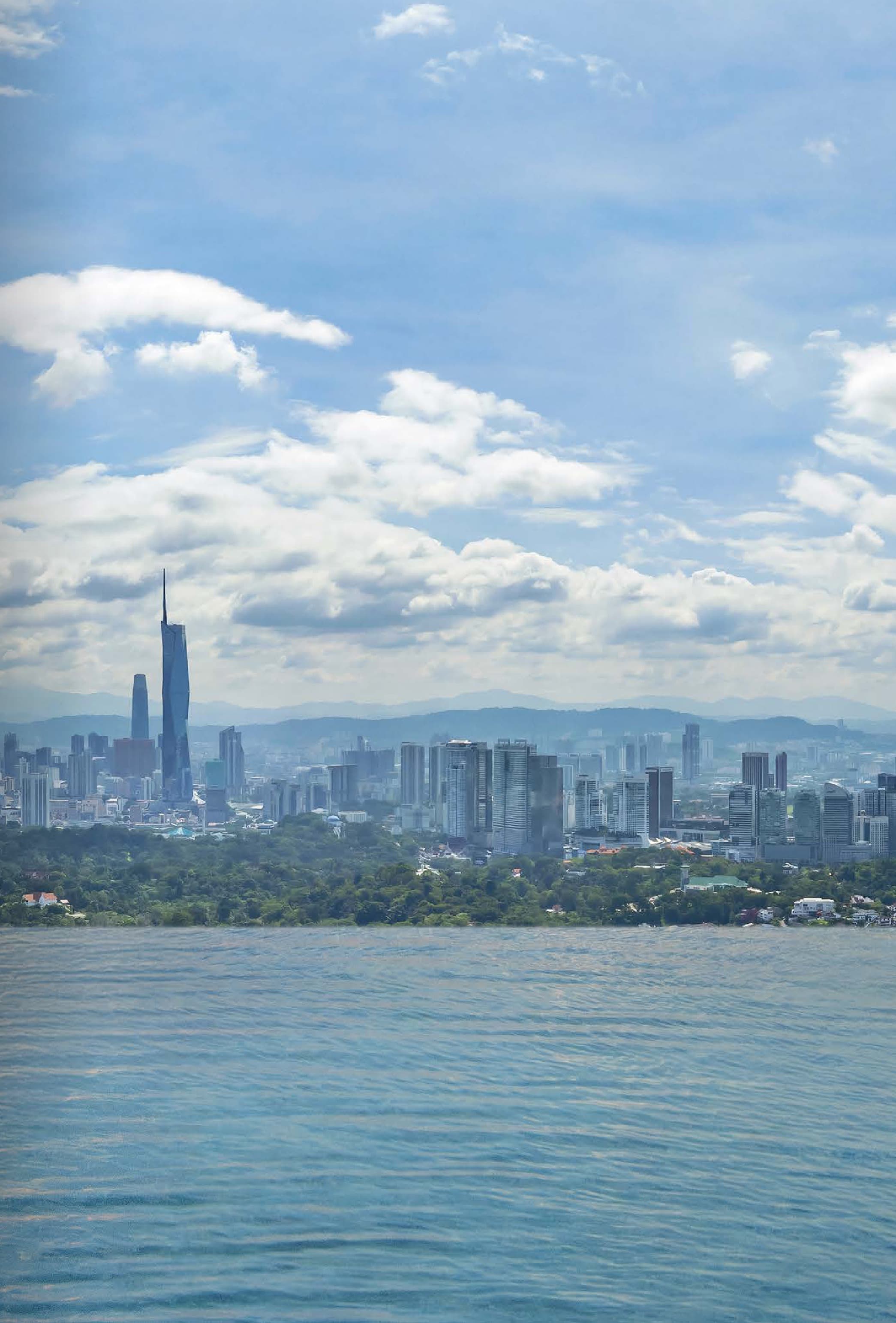 Royal Suites, Level 51 — the heated sky pool's view across Kuala Lumpur, with Merdeka 118 and the Petronas Twin Towers on the horizon