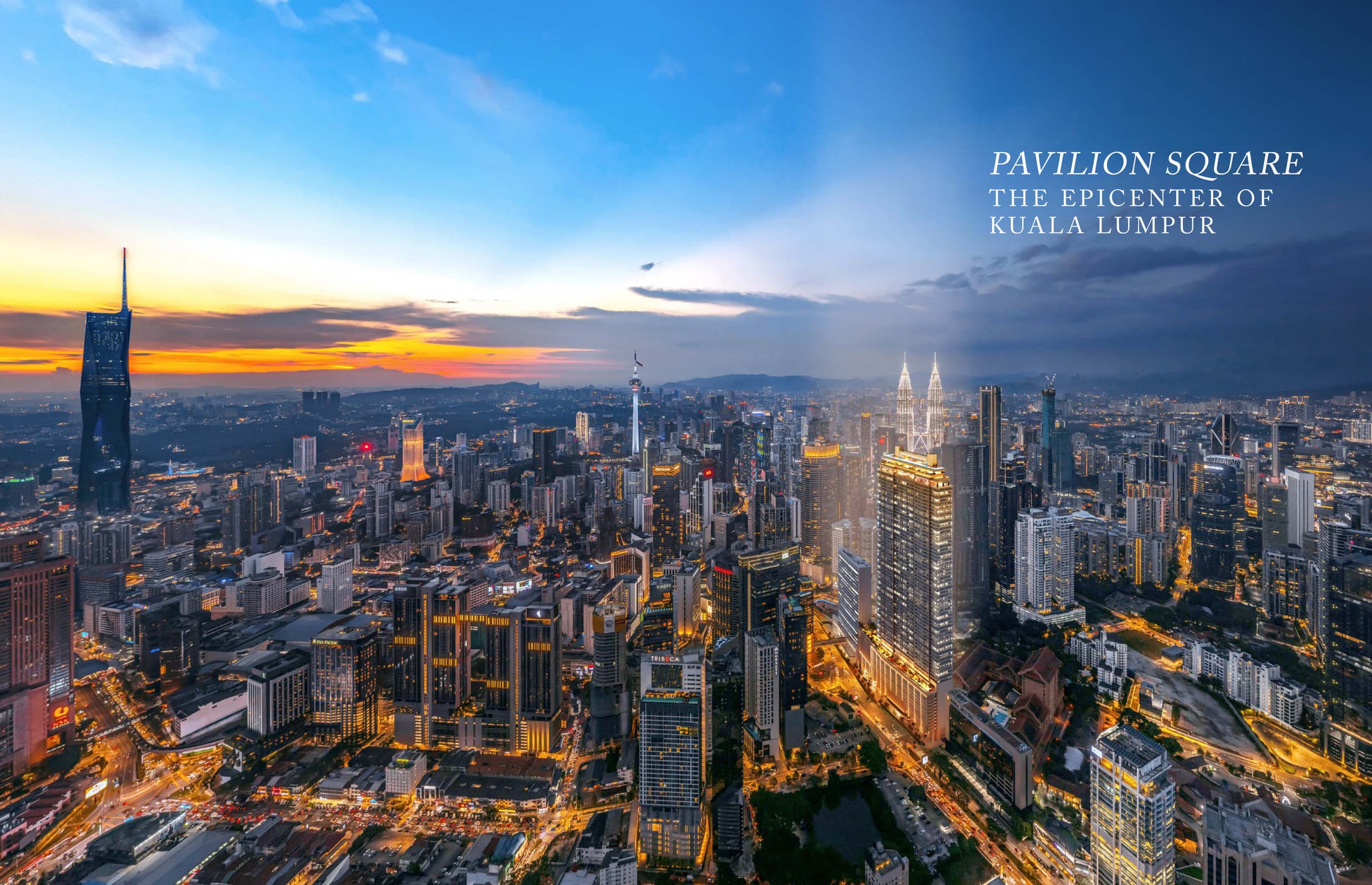 The Kuala Lumpur skyline at dusk from above the Golden Triangle, with Merdeka 118 on the left, the KL Tower at the centre and the Petronas Twin Towers on the right