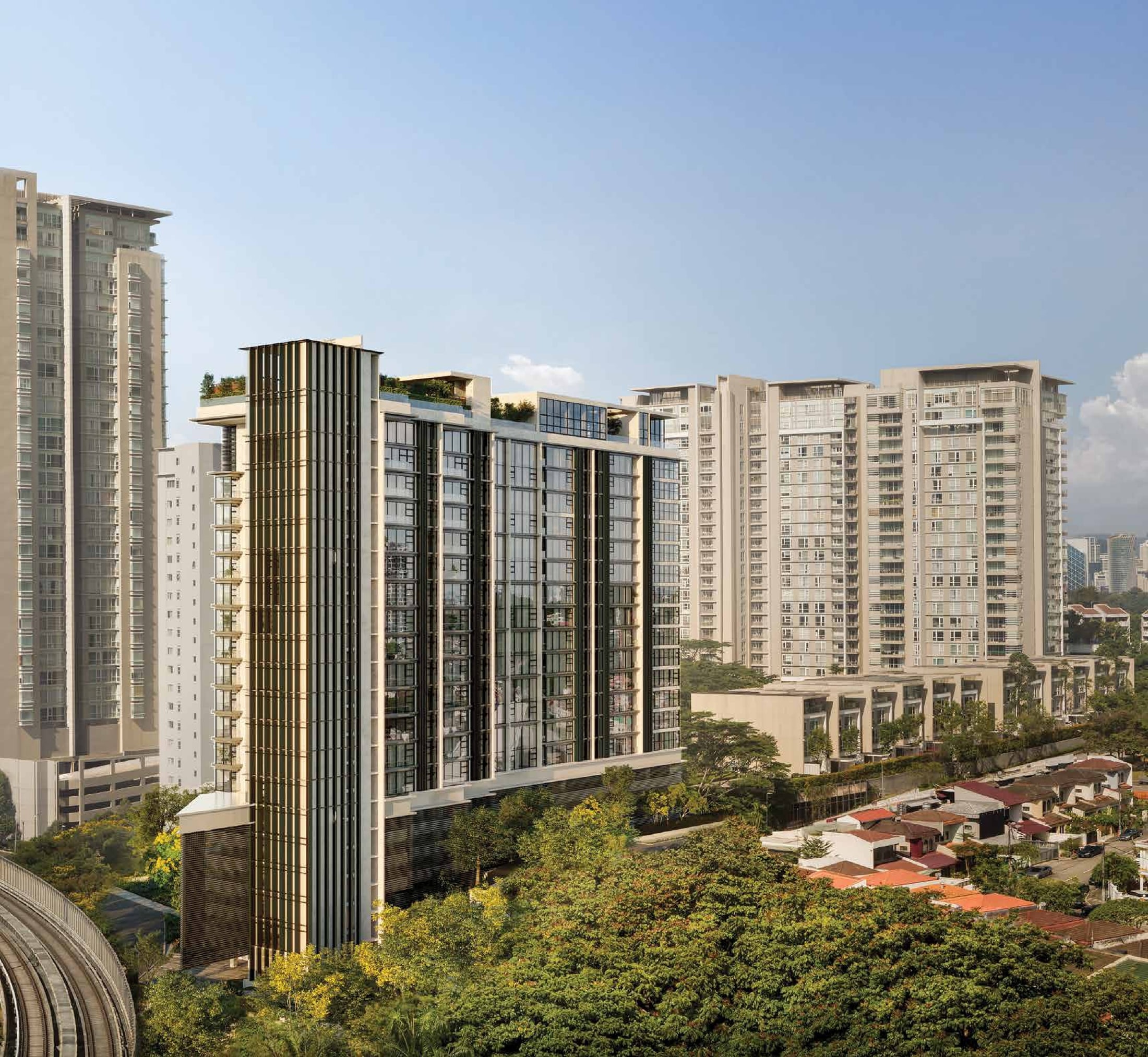 111 Menerung, Bangsar — the completed building seen from above, its bronze-finned lift tower rising at the near corner above the treeline, with the Bangsar high-rises behind