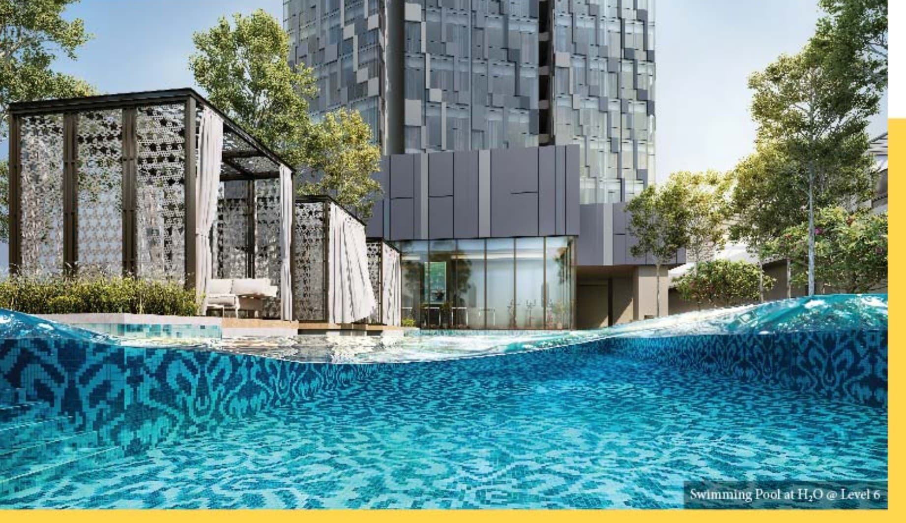 The swimming pool at H₂O on Level 6 — patterned tilework under the water, cabanas along the deck