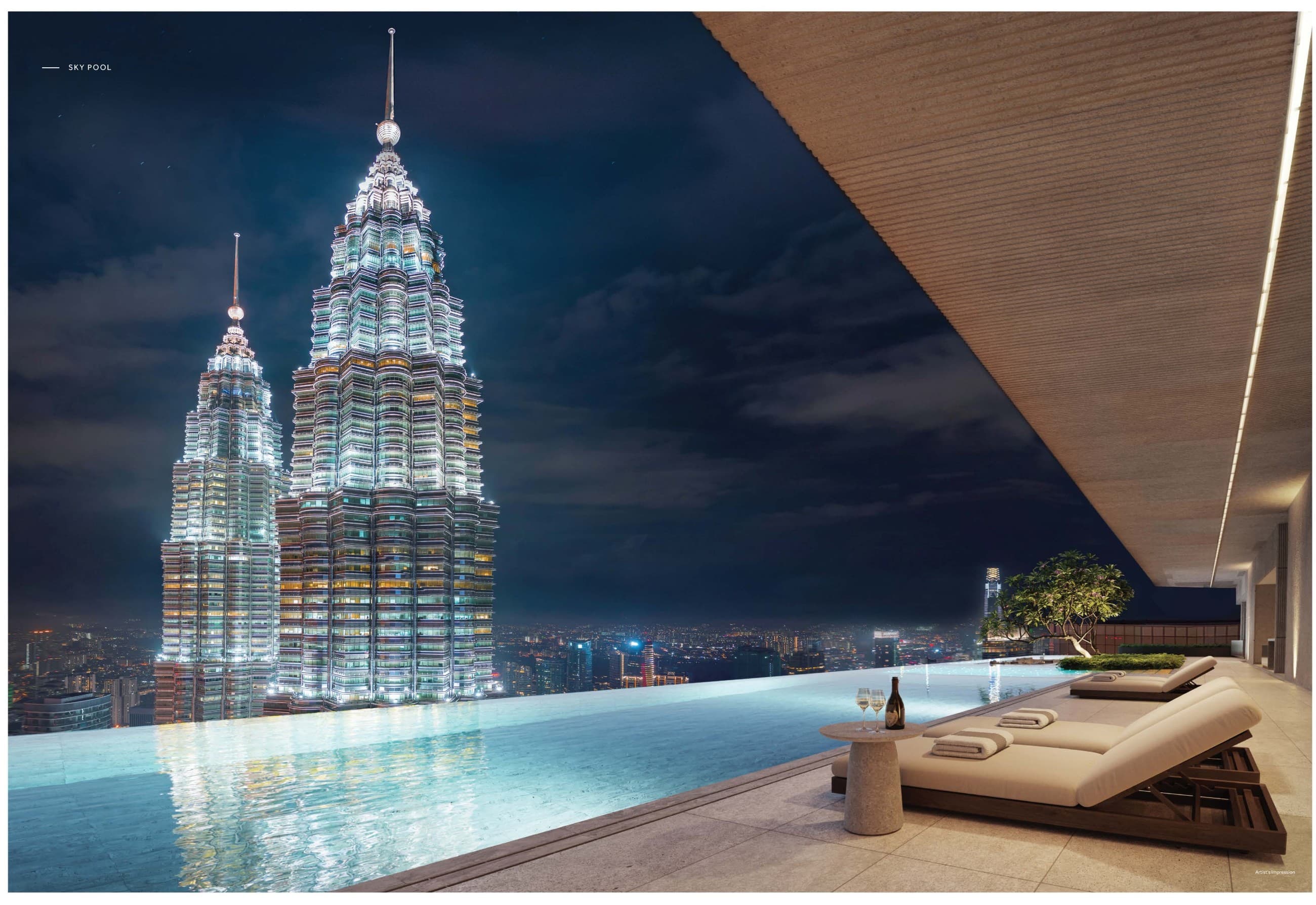 The sky pool — the infinity edge set against the illuminated Petronas Twin Towers, with the timber soffit overhead
