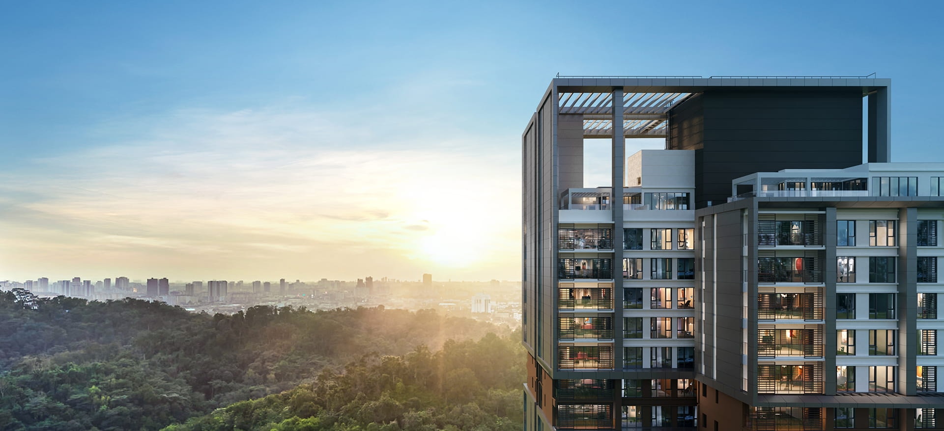 Enlace Suites 2 — the tower above the Bukit Kerinchi forest reserve at sunset, with the KL skyline behind