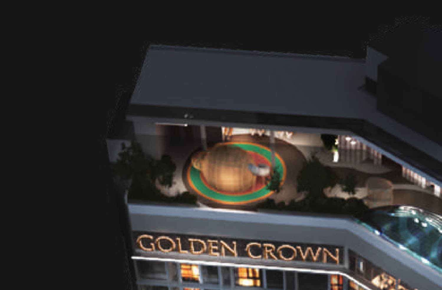 The far end of the sky deck — the domed children's playground in its coloured ring, planting and resting corners around it, and the GOLDEN CROWN crown-line signage on the facade below