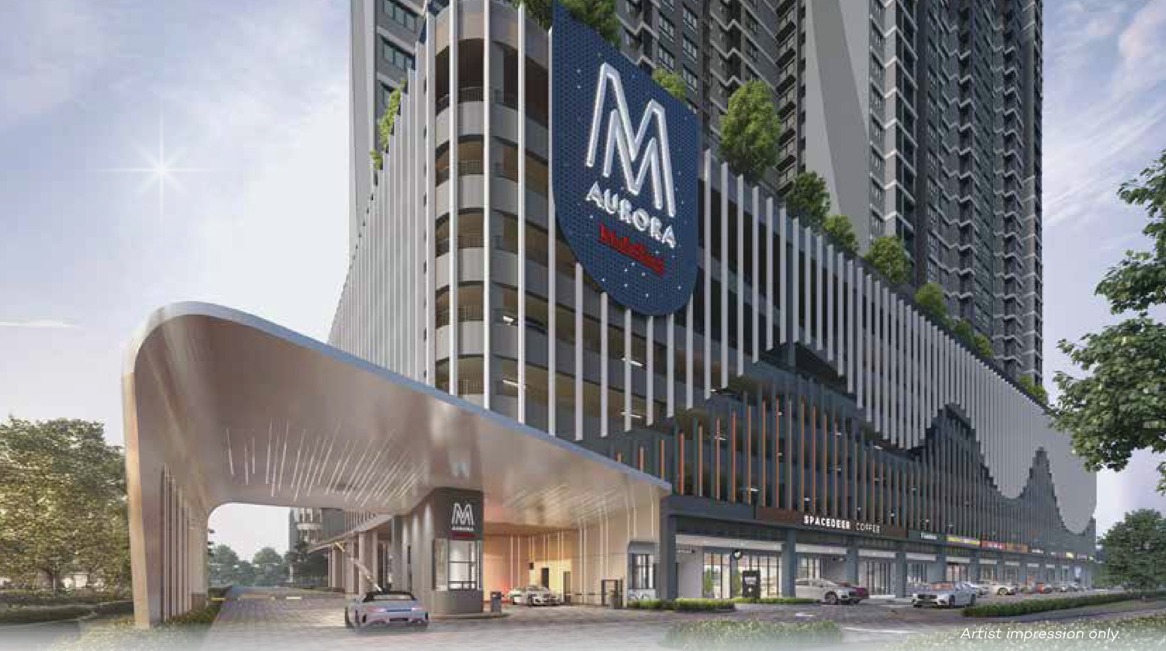 M Aurora — the drop-off under the curved entrance canopy, with the retail frontage and the towers above it on Old Klang Road, Kuala Lumpur