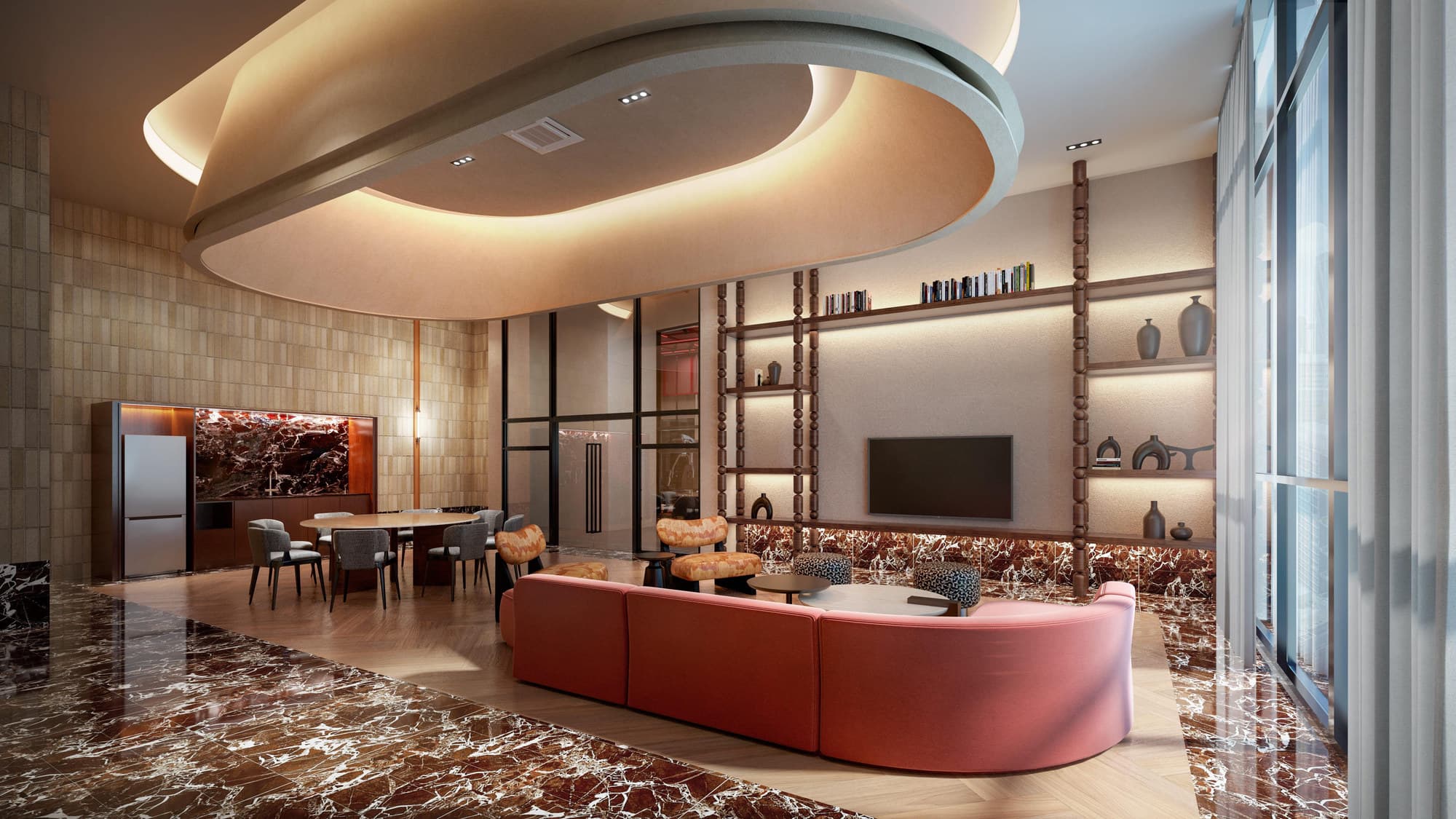 The sky lounge — a shared kitchen and dining table at one end, a curved sofa and a media wall at the other, wrapped in full-height glazing over the skyline