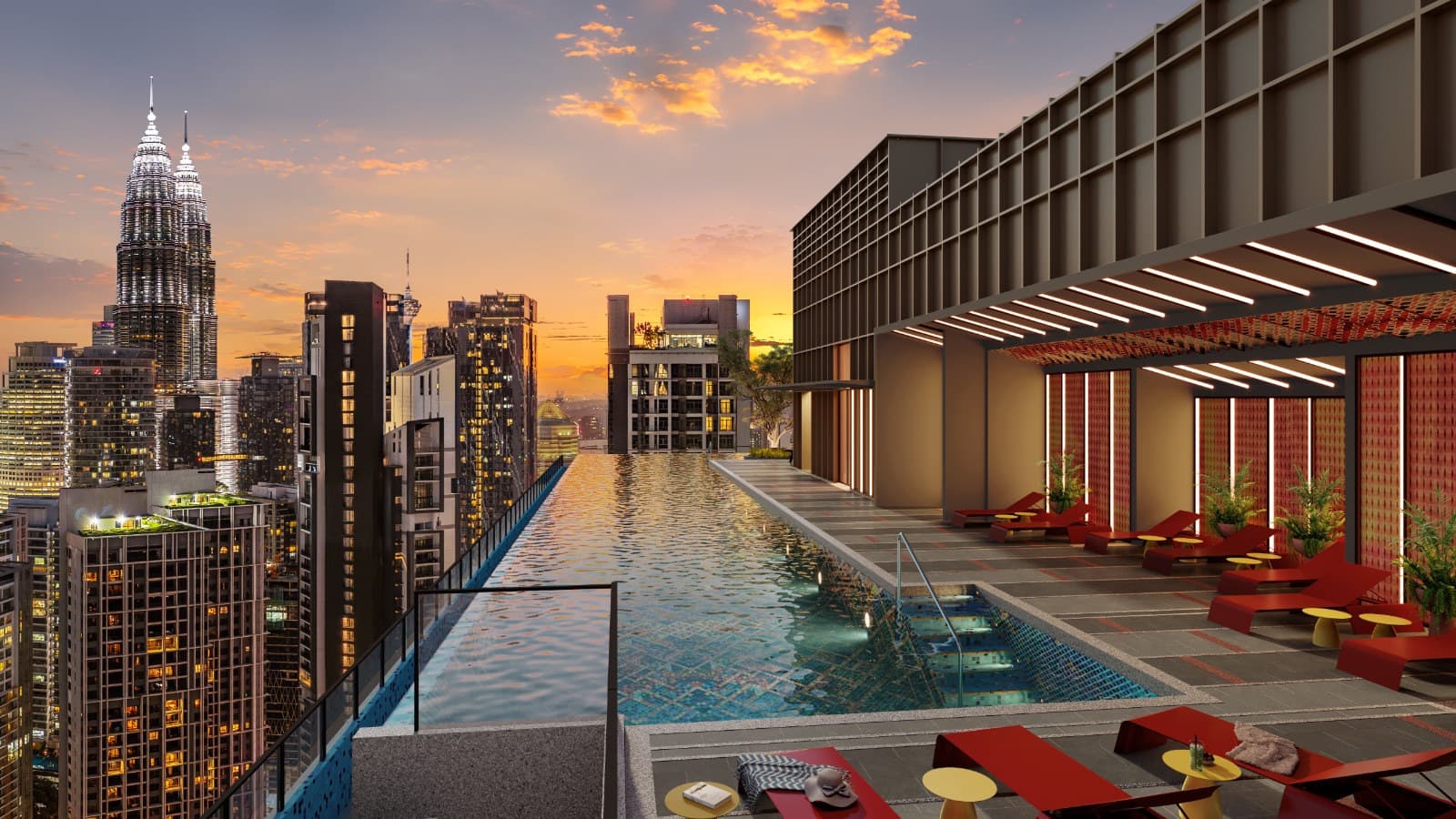 The sky infinity pool at dusk — the water running out along the tower's edge towards the Petronas Twin Towers, with the cabana deck and its slatted canopy down the sheltered side