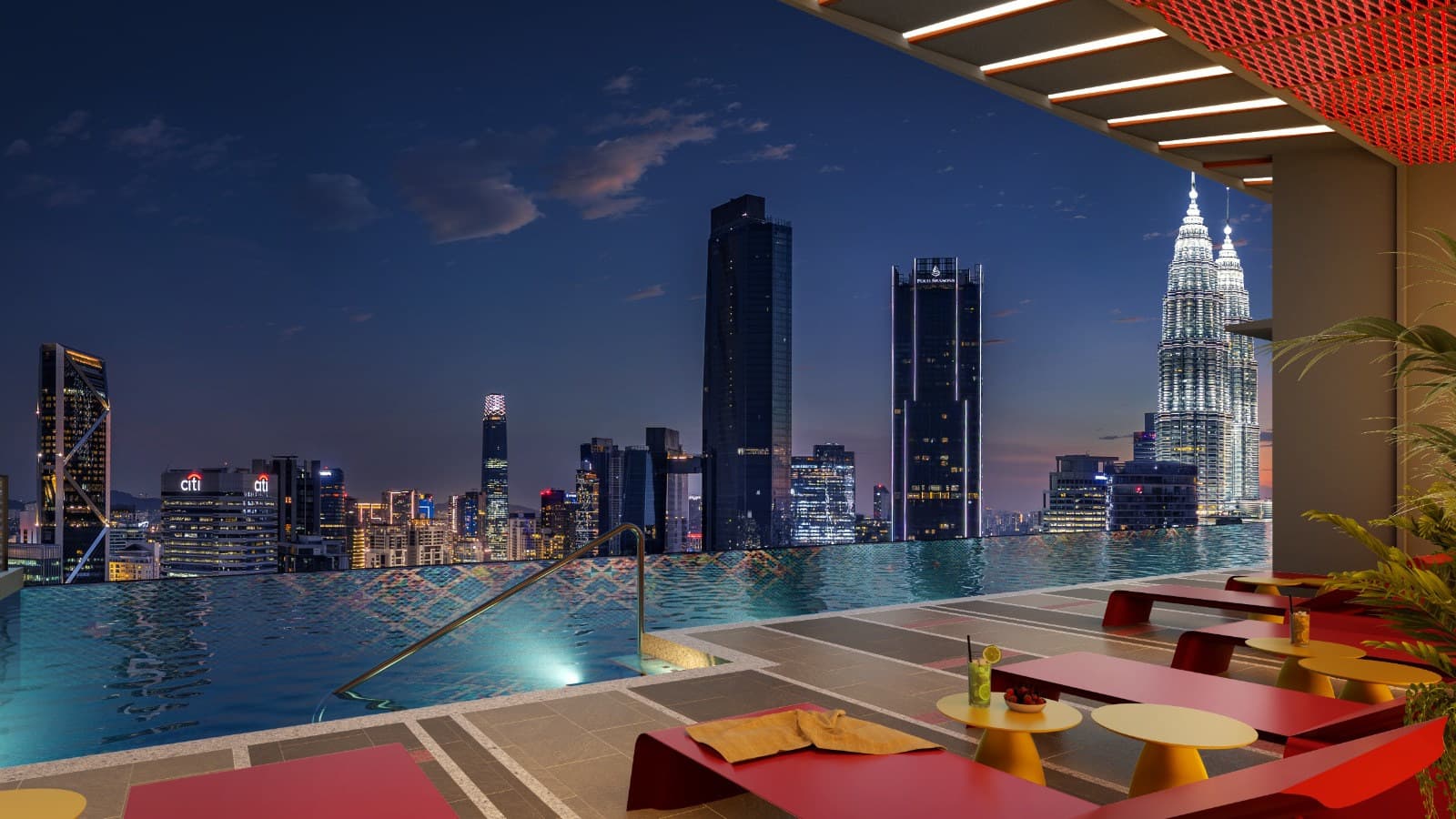 The same pool after dark, looking south-west across the KL skyline — Four Seasons, Ilham Tower and the Twin Towers all inside the frame from the water