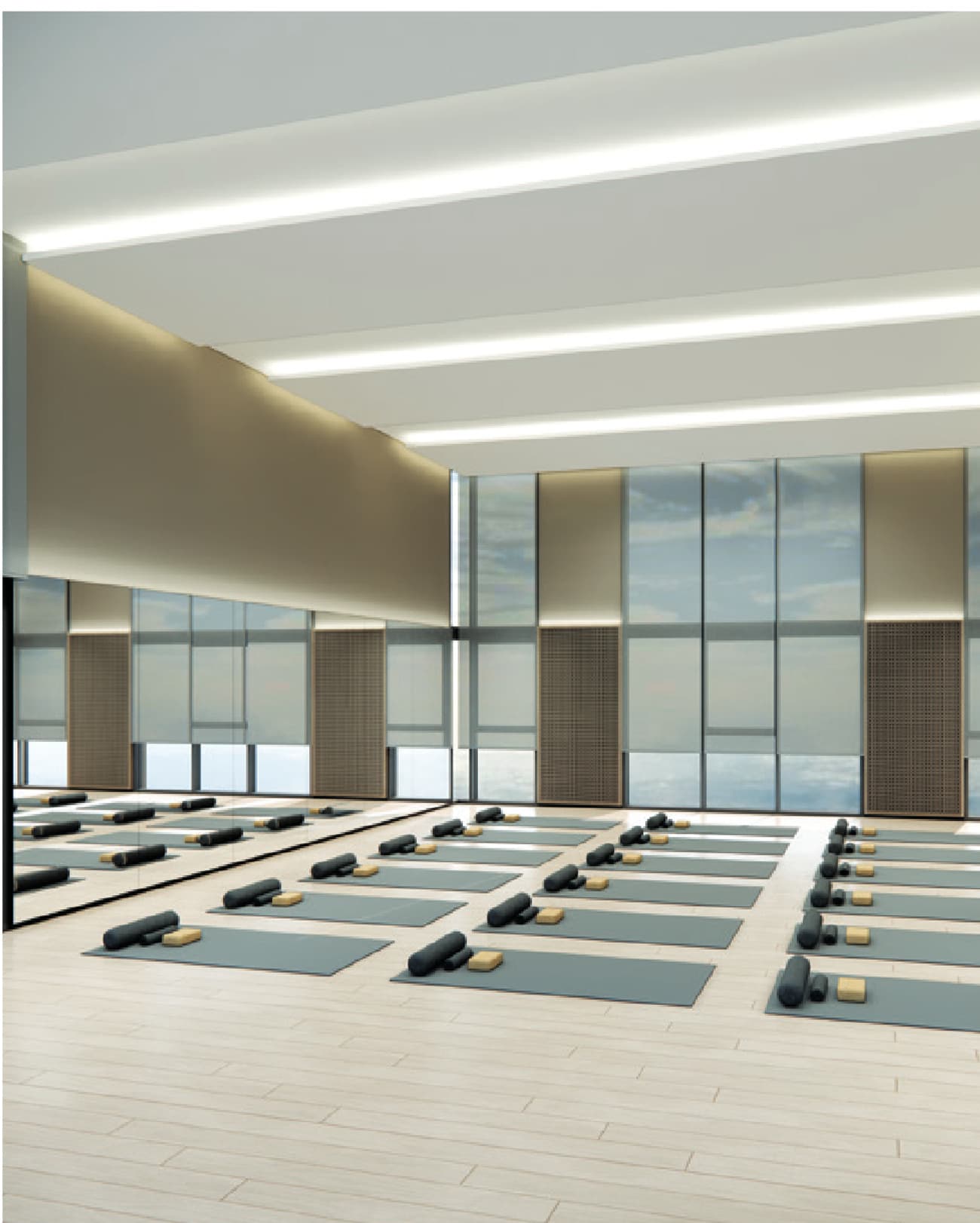 Yoga Room — a double-height mirrored studio laid out for a full class, glazed to the ceiling on the outside wall
