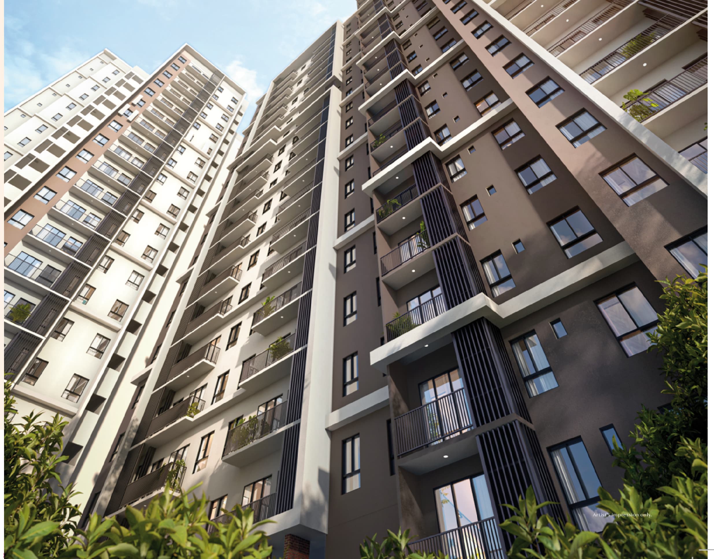 The two 21-storey blocks at RIA @ Sunsuria Kwasa Damansara seen from the landscaped grounds below, with recessed balconies down every facade