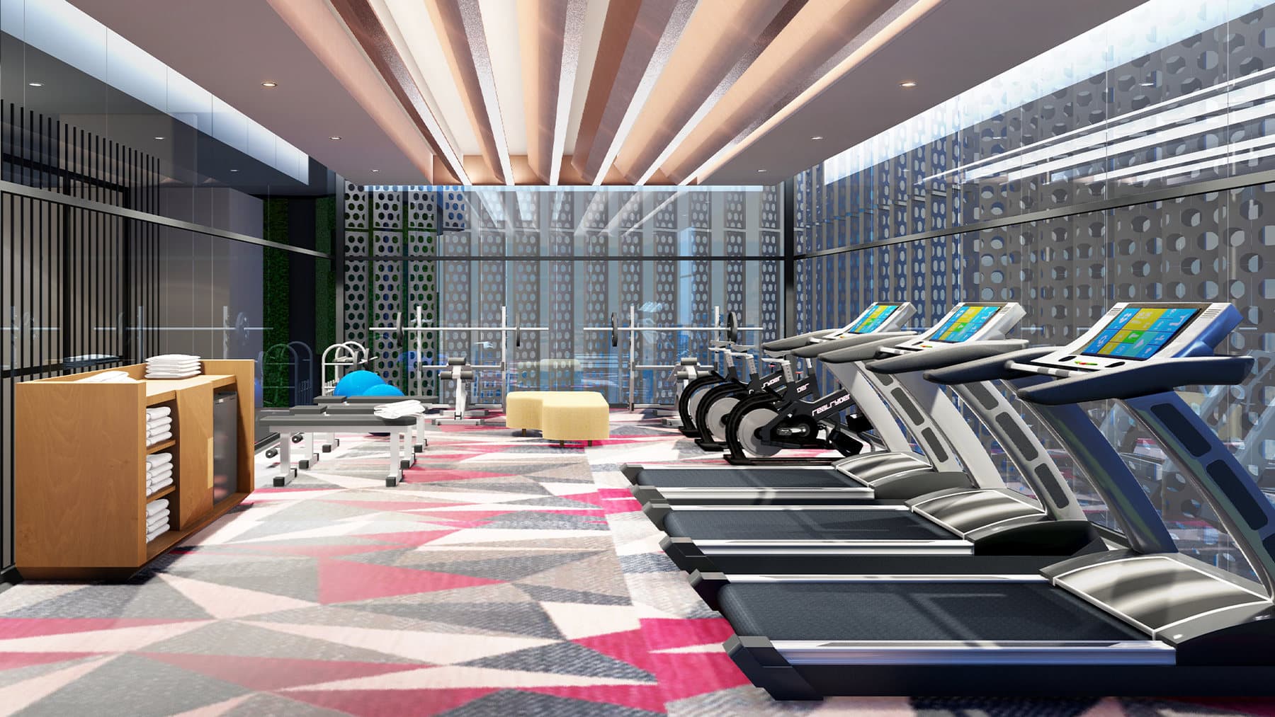 The gymnasium — cardio on the glazed wall, under a slatted ceiling, on the residents' facility deck