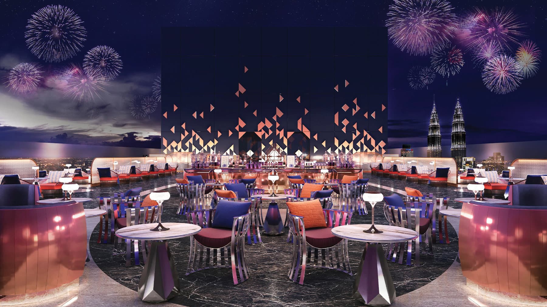 The sky lounge on the upper facility floors — open-air seating under a lit canopy with the Petronas Twin Towers on the skyline