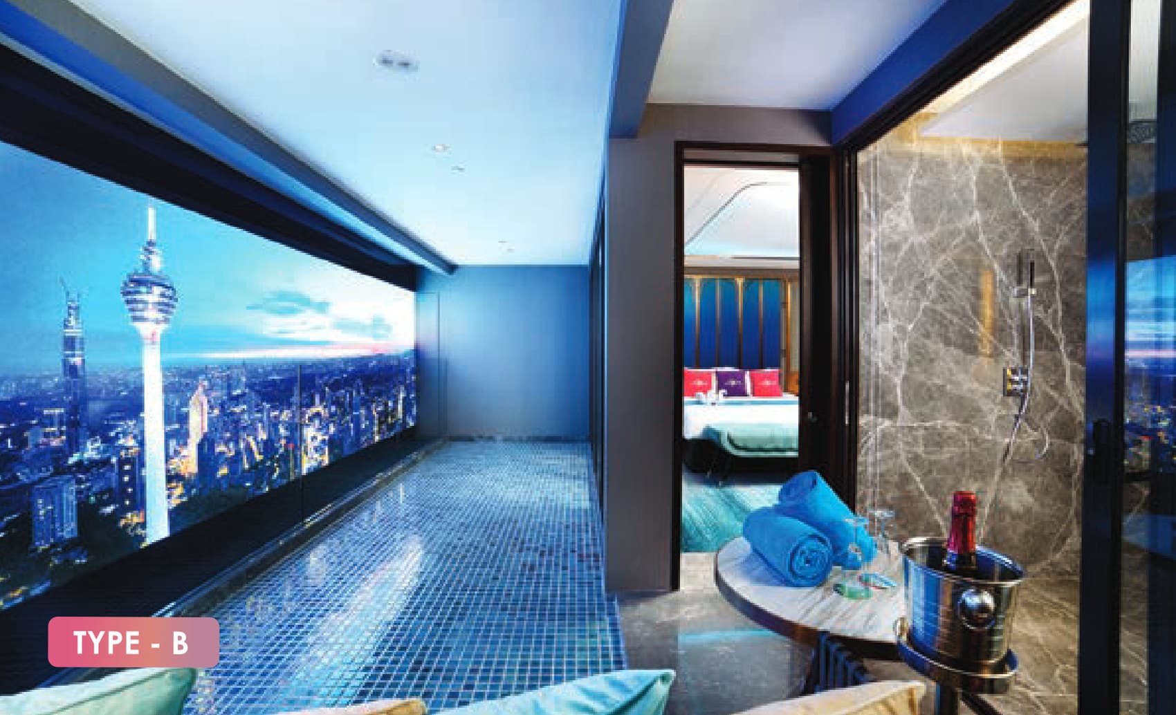 Royal Lexis Type B private pool — a mosaic-tiled lap pool inside the suite running to a full-height window over the city at night, with the bedroom through the opening beside it