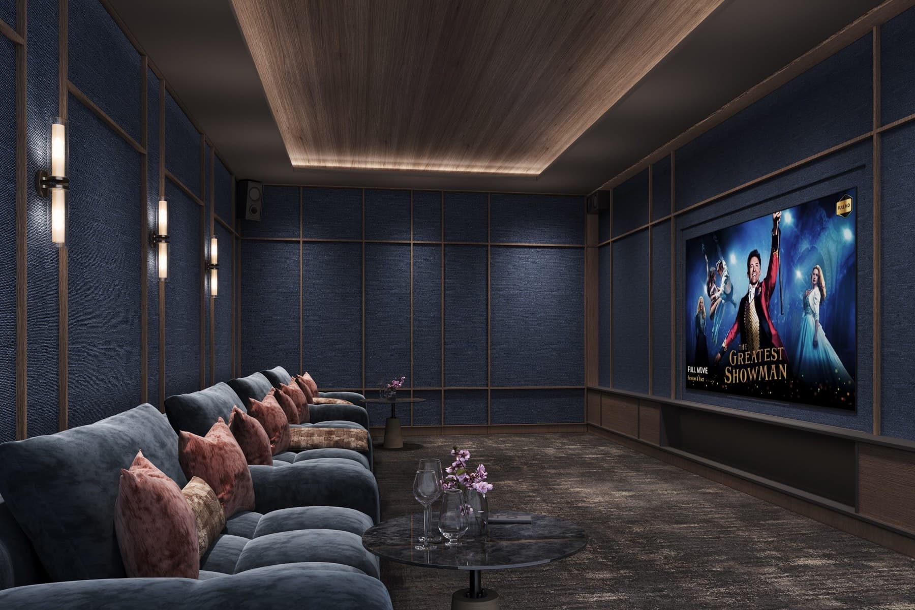 Cinema Room — tiered lounge seating in navy velvet facing a full-wall screen. The developer publishes this render but does not label a cinema on its numbered facility plans, so ask which level it sits on