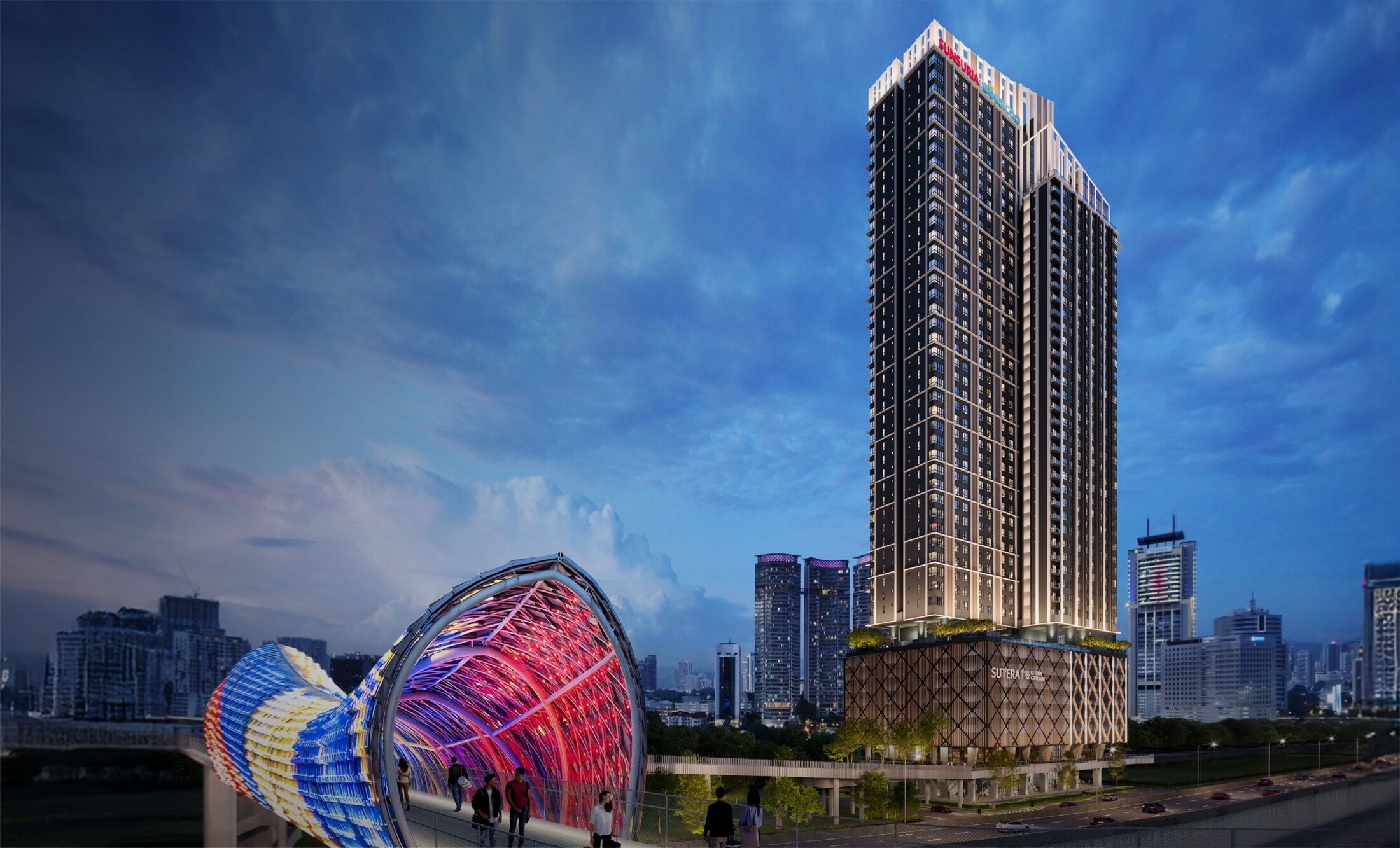 Sutera Suites at KL City Gateway — the 46-storey tower at dusk behind the lit Saloma Link Bridge, with the AKLEH running past its podium and the Kuala Lumpur skyline beyond